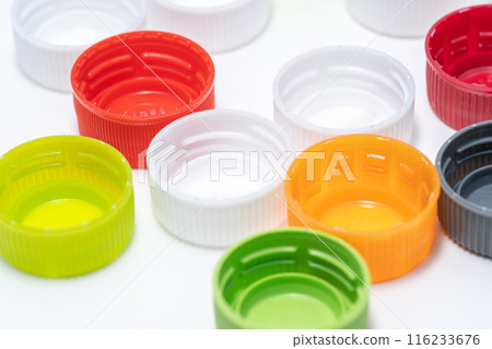 Plastic bottle caps being sorted for recycling 116233676