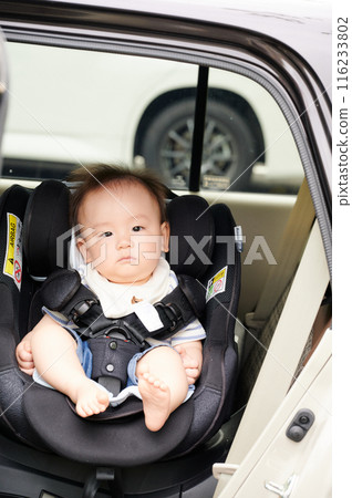 Baby sitting on a child seat Baby sitting on a child seat 116233802