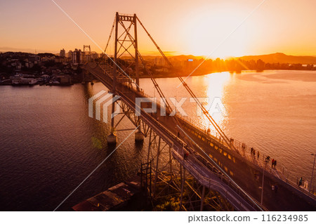 Hercilio luz old bridge with golden sunset sky in Florianopolis. Drone view Hercilio luz old bridge with golden sunset sky in Florianopolis. Drone view 116234985