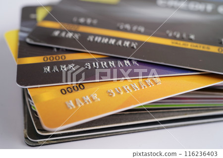 Credit card on graph paper for online shopping, security finance business. Credit card on graph paper for online shopping, security finance business. 116236403