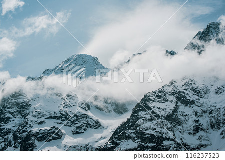 Mountain peaks near Morskie Oko or Sea Eye Lake in Poland at Winter. Tatras range Mountain peaks near Morskie Oko or Sea Eye Lake in Poland at Winter. Tatras range 116237523