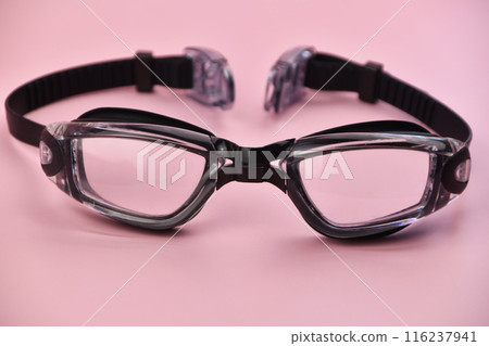 Swimming goggles on pink background 116237941