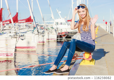 woman in marina against yachts in port 116238082