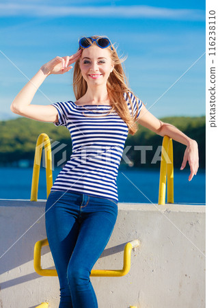 woman casual style against stone wall woman casual style against stone wall 116238110