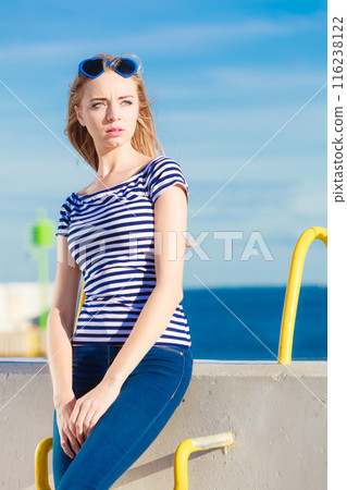 woman casual style against stone wall woman casual style against stone wall 116238122