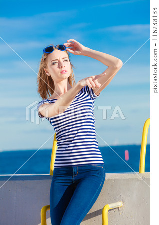woman casual style against stone wall woman casual style against stone wall 116238133
