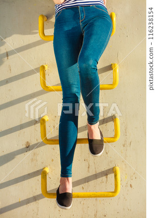 Woman legs in denim trousers casual style outdoor Woman legs in denim trousers casual style outdoor 116238154
