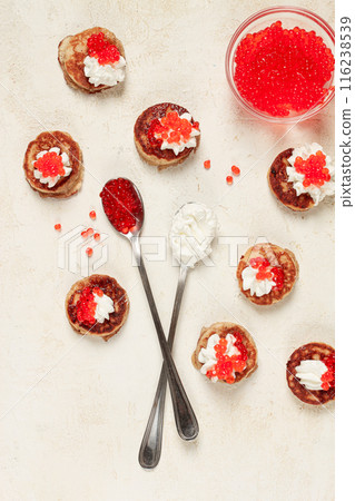 Demidoff pancakes, mini pancakes, with sour cream and red caviar, crepes. homemade, no people, 116238539