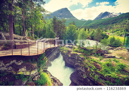 Tourist with camera on Gudbrandsjuvet waterfall, Norway 116238869