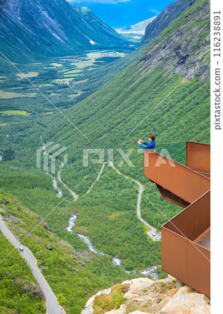 Tourist woman on Trollstigen viewpoint in Norway 116238891