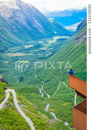 Tourist woman on Trollstigen viewpoint in Norway Tourist woman on Trollstigen viewpoint in Norway 116238895