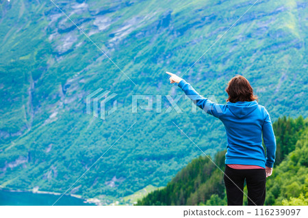 Woman tourist in norwegian mountains fjords Woman tourist in norwegian mountains fjords 116239097