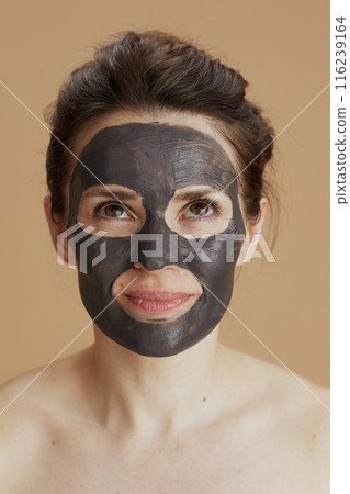 young 40 years old woman with facial mask 116239164
