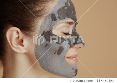 relaxed young 40 years old woman with facial mask relaxed young 40 years old woman with facial mask 116239168