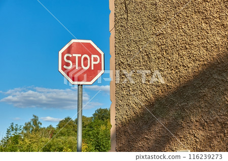 Stop sign on a corner Stop sign on a corner 116239273