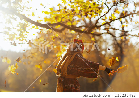 smiling elegant woman in red hat with scarf rejoicing smiling elegant woman in red hat with scarf rejoicing 116239482