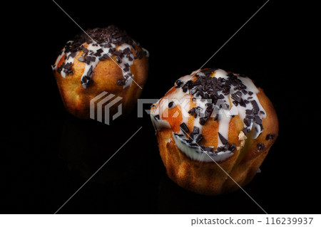 Cupcake muffin with chocolate sprinkle on a dark background 116239937