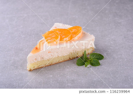Orange cheesecake on a gray background for a coffee shop menu Orange cheesecake on a gray background for a coffee shop menu 116239964