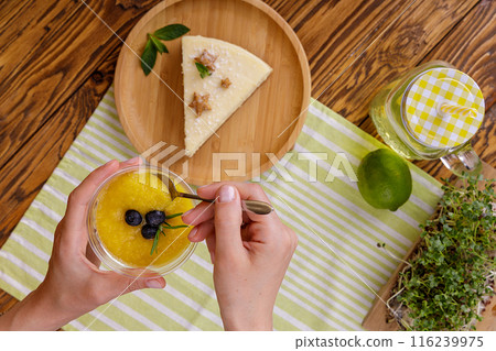 Homemade vanilla cheesecake with vanilla flower on white background - healthy organic summer dessert pie cheesecake. Cheesecake New York. Side view, copy space for text. Menu, recipe, confectionery 116239975