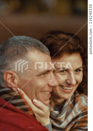 smiling modern couple in park having fun time smiling modern couple in park having fun time 116240338