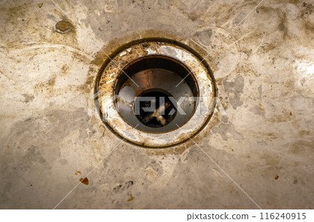 Dirty drain in the bathroom, cleaning service concept, old rusty shower drain Dirty drain in the bathroom, cleaning service concept, old rusty shower drain 116240915
