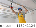 Senior adult worker fixing aluminum batten for gypsum ceiling 116241124