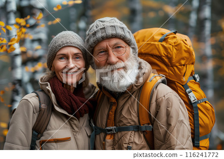 Portrait Of Senior Couple Hiking Through Countryside 116241772