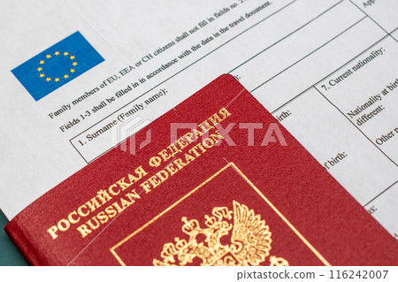 Russian travel passport with Schengen visa application form, sanctions, emigration, immigration, tourism concept 116242007