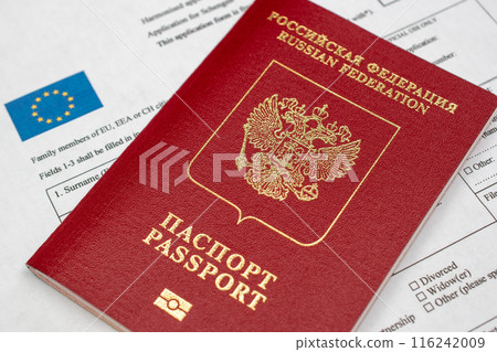 Russian travel passport with Schengen visa application form, sanctions, emigration, immigration, tourism concept 116242009
