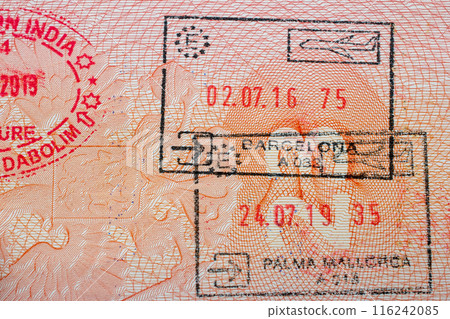 Stamps in a travel passport, entry and exit stamp, emigration, immigration, tourism concept 116242085