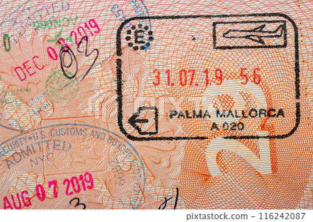 Stamps in a travel passport, entry and exit stamp, emigration, immigration, tourism concept 116242087
