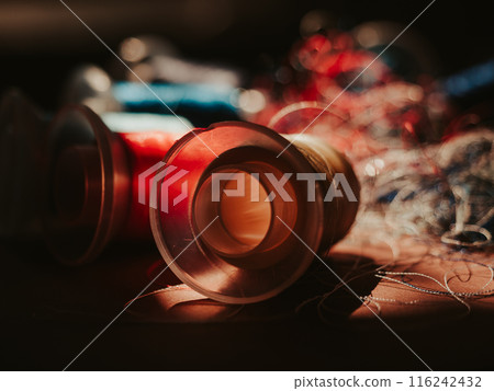 Spools of colored embroidery threads. Huge knot is haphazardly braided. Extreme macro. Beautiful story for intro. Title credits. Abstract screensaver. Handicraft entropy concept. Disorder measure 116242432