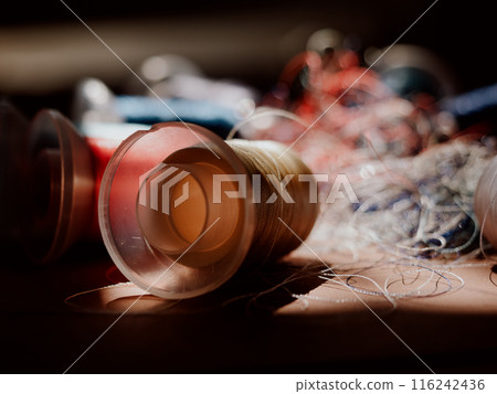 Spools of colored embroidery threads. Huge knot is haphazardly braided. Extreme macro. Beautiful story for intro. Title credits. Abstract screensaver. Handicraft entropy concept. Disorder measure Spools of colored embroidery threads. Huge knot is haphazardly braided. Extreme macro. Beautiful story for intro. Title credits. Abstract screensaver. Handicraft entropy concept. Disorder measure 116242436