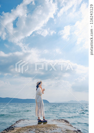 Young woman enjoying the sea 116243129