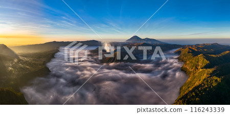 Aerial view Mountains at Bromo volcano during sunrise sky,Beautiful Mountains Penanjakan in Bromo Tengger Semeru National Park,East Java,Indonesia.Nature landscape background Aerial view Mountains at Bromo volcano during sunrise sky,Beautiful Mountains Penanjakan in Bromo Tengger Semeru National Park,East Java,Indonesia.Nature landscape background 116243339