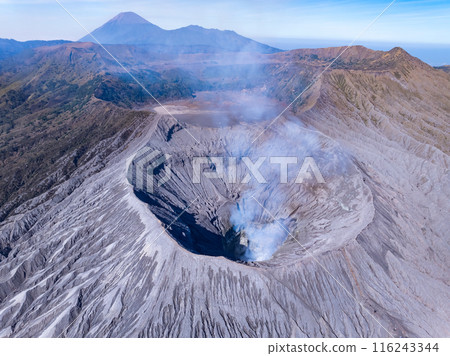 Aerial view Mountains at Bromo volcano during sunrise sky,Beautiful Mountains Penanjakan in Bromo Tengger Semeru National Park,East Java,Indonesia.Nature landscape background Aerial view Mountains at Bromo volcano during sunrise sky,Beautiful Mountains Penanjakan in Bromo Tengger Semeru National Park,East Java,Indonesia.Nature landscape background 116243344