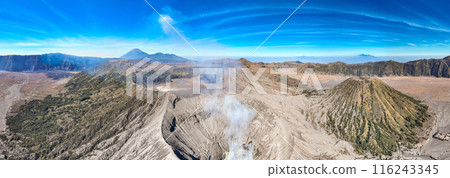 Aerial view Mountains at Bromo volcano during sunrise sky,Beautiful Mountains Penanjakan in Bromo Tengger Semeru National Park,East Java,Indonesia.Nature landscape background Aerial view Mountains at Bromo volcano during sunrise sky,Beautiful Mountains Penanjakan in Bromo Tengger Semeru National Park,East Java,Indonesia.Nature landscape background 116243345