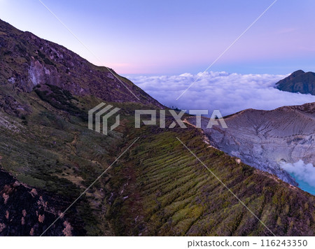 Aerial view Kawah Ijen volcano with turquoise sulfur water lake at sunrise.Amazing nature landscape view at East Java, Indonesia. Natural landscape background 116243350