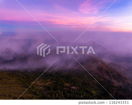 Beautiful landscape view Mountains with fog in sunrise sky at Indonesia 116243351