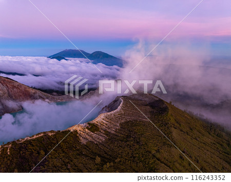 Aerial view Kawah Ijen volcano with turquoise sulfur water lake at sunrise.Amazing nature landscape view at East Java, Indonesia. Natural landscape background Aerial view Kawah Ijen volcano with turquoise sulfur water lake at sunrise.Amazing nature landscape view at East Java, Indonesia. Natural landscape background 116243352