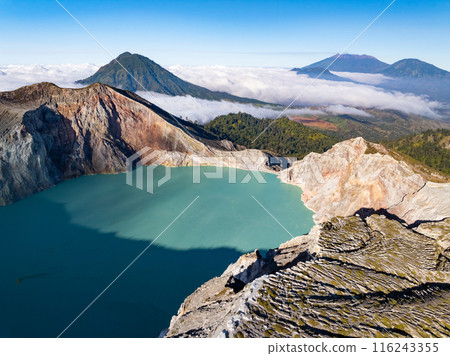 Aerial view Kawah Ijen volcano with turquoise sulfur water lake at sunrise.Amazing nature landscape view at East Java, Indonesia. Natural landscape background Aerial view Kawah Ijen volcano with turquoise sulfur water lake at sunrise.Amazing nature landscape view at East Java, Indonesia. Natural landscape background 116243355
