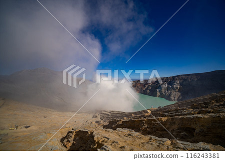 Aerial view Kawah Ijen volcano with turquoise sulfur water lake at sunrise.Amazing nature landscape view at East Java, Indonesia. Natural landscape background 116243381