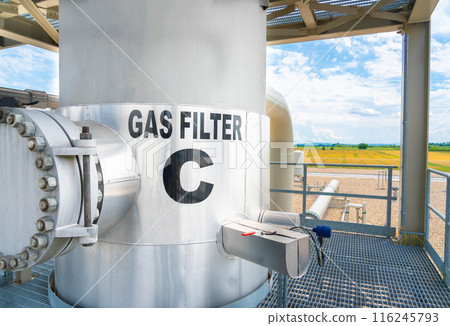 Natural gas cleaning filter with beautiful landscape in the background. Eco-friendly production concept 116245793