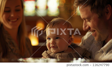 Parents baptize their baby in church 116247790
