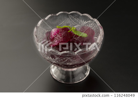 Red shiso sorbet glass on black background 116248049