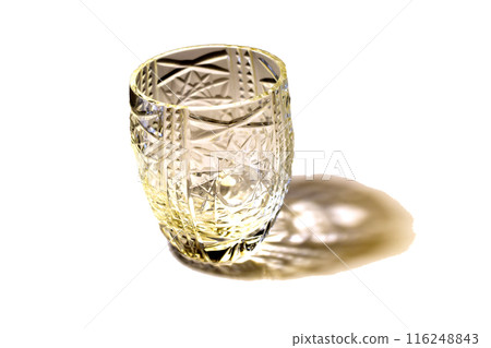 One glass and its shadow on a white background One glass and its shadow on a white background 116248843