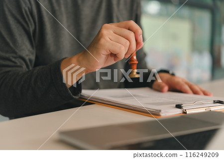 Contract law or paper work business and finance document rubber stamp. For official and legal contracts and agreements, financial statements, investment contracts, real estate documents. Contract law or paper work business and finance document rubber stamp. For official and legal contracts and agreements, financial statements, investment contracts, real estate documents. 116249209