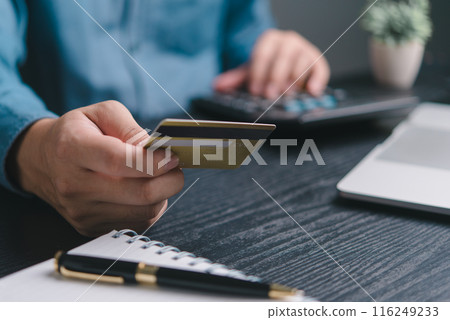A person is holding a credit card A person is holding a credit card 116249233