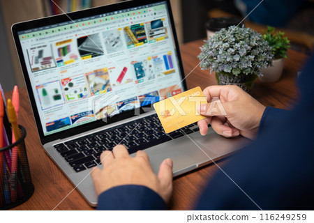 Business man holding credit card using computer laptop online payment internet banking and financial purchase e commerce shopping Business man holding credit card using computer laptop online payment internet banking and financial purchase e commerce shopping 116249259
