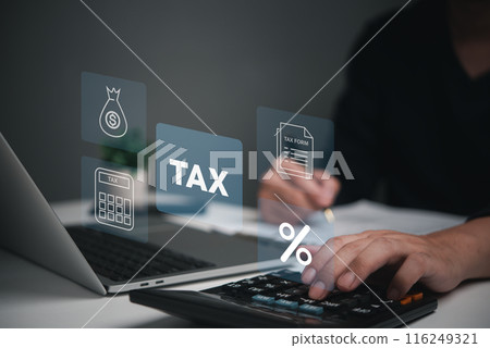 A person works on tax calculations using a laptop, with digital tax-related icons floating above.. A person works on tax calculations using a laptop, with digital tax-related icons floating above.. 116249321